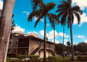 Thumbnail 7 of 19 - Exterior of building with parking and landscape at Golden Lakes, Miami, 33169