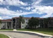 Thumbnail 1 of 7 - Driveway to leasing office at Eagles Landing, Miami Gardens, FL