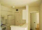 Thumbnail 7 of 7 - Kitchen with white cabinets and appliances at Eagles Landing, Miami Gardens, FL