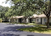Thumbnail 3 of 6 - Exterior building view with landscape at Grove Pointe, Ruskin, FL