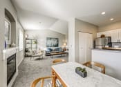 Thumbnail 6 of 63 - Kitchen and living room at BELLA SONOMA, Fife, 98424