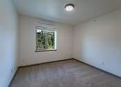 Thumbnail 6 of 8 - bedroom with a window at TRILLIUM LANDING, JUNEAU