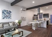 Thumbnail 4 of 41 - a living room and kitchen area with white walls and hardwood floors at THE ANGELINO, Sacramento, CA
