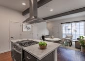 Thumbnail 3 of 41 - a kitchen with a stove and a table with chairs at THE ANGELINO, California, 95819