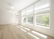 Thumbnail 25 of 34 - Large room with window and wood floors at FARM BY VINTAGE, MILL CREEK, WA