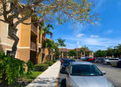 Thumbnail 8 of 13 - Parking near sidewalk and building at Hibiscus Pointe, Miami, FL