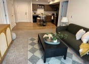 Thumbnail 32 of 34 - a living room with a couch and a coffee table at FARM BY VINTAGE, MILL CREEK