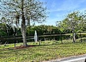 Thumbnail 1 of 21 - a view of the pond and fountain from the parking lot at SUMMERBREEZE & SUMMERSET, ST. AUGUSTINE, FL 32086