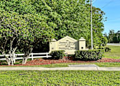 Thumbnail 2 of 21 - a photo of the summer breeze sign in front of a white fence and trees at SUMMERBREEZE & SUMMERSET, ST. AUGUSTINE, 32086