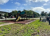 Thumbnail 6 of 21 - a playground with a slide and monkey bars at SUMMERBREEZE & SUMMERSET, ST. AUGUSTINE, FL 