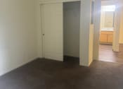 Thumbnail 14 of 14 - an empty living room with a closet and a bathroom at VINTAGE AT CITI VISTA, Reno