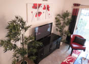 Thumbnail 8 of 11 - Monterey Pointe Apartments apartment home living area with balcony at Monterey Pointe, Florida