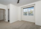 Thumbnail 29 of 41 - a bedroom with white walls and carpet at THE ANGELINO, Sacramento
