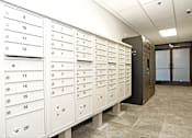 Thumbnail 16 of 20 - A row of white mailboxes numbered from 1 to 16 with a black mailbox labeled 2P at LOFT 205 Apartments, Reno, NV