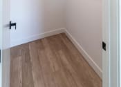 Thumbnail 14 of 24 - a room with a wood floor and a white wall with ceiling at Luella, Sacramento, CA, 95811