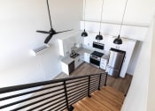 Thumbnail 15 of 24 - an overhead view of a kitchen with a stainless steel refrigerator at Luella, Sacramento, CA
