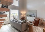 Thumbnail 3 of 24 - a living room with a couch and chairs and a large window at Luella, Sacramento, CA