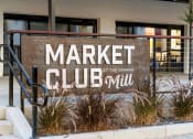 Thumbnail 1 of 81 - the sign for market club in front of a building