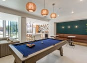 Thumbnail 21 of 33 - clubhouse with pool table at the preserve at great pond apartments in windsor tx