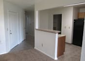 Thumbnail 7 of 28 - A white room with a brown counter.