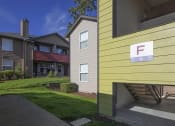 Thumbnail 46 of 46 - Building Surrounded By Lush Landscaping with View of Outdoor Lounge at TOWNSHIP Apartments, CANBY, OR