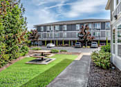 Thumbnail 19 of 29 - Outdoor Seating at Fairview Village Apartments, Fairview, Oregon