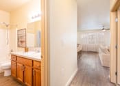 Thumbnail 9 of 34 - A bathroom with a walk-in shower and a vanity with a mirror. at Fairview Village Homes, Fairview, 97024