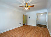 Thumbnail 12 of 36 - A room with a ceiling fan and wooden flooring.at Palladian Apartments, Oregon ? 