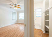 Thumbnail 13 of 36 - A room with a ceiling fan and wooden floors.at Palladian Apartments, Portland, 97201 ? 