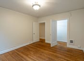 Thumbnail 14 of 36 - A room with wooden floors and white walls.at Palladian Apartments, Portland ? 
