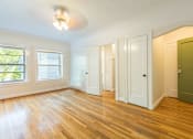 Thumbnail 10 of 36 - A room with wooden floors and white walls.at Palladian Apartments, Portland, OR ? 