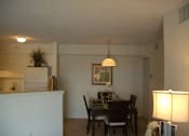 Thumbnail 12 of 15 - Dining and kitchen area at Bernwood Trace Apartments, Fort Myers
