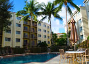 Thumbnail 2 of 17 - Pool And Building Exterior at Laguna Pointe, Pompano Beach, FL