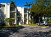Thumbnail 23 of 28 - Oaks at Pompano community exterior and parking at Oaks at Pompano, Pompano Beach