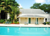 Thumbnail 3 of 18 - Pool with lounge chairs at Bay Winds, Florida