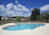 Thumbnail 7 of 14 - Mission  Pointe apartments resort style pool with lounge chairs at Mission Pointe Apartments, Florida, 32218