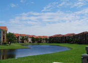 Thumbnail 3 of 15 - Renaissance community exterior with palm trees and lake views at Renaissance, West Palm Beach