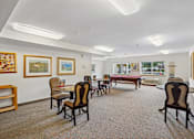 Thumbnail 20 of 26 - A room with a pool table and chairs at Vintage at Burien, Washington