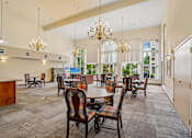 Thumbnail 21 of 26 - A large room with a dining table and chairs at Vintage at Burien, Burien, Washington