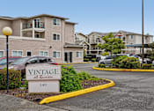 Thumbnail 4 of 26 - A sign for Vintage at Burien is in front of a building at Vintage at Burien,Burien,WA