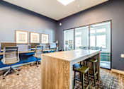 Thumbnail 5 of 18 - A room with a bar and chairs at View by Vintage Apartments, Bonney Lake, WA 98391