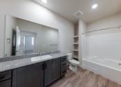 Thumbnail 8 of 14 - the renovated bathroom in a new home with a shower toilet and sink at Springview by Vintage, Nevada