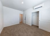Thumbnail 4 of 14 - a room with carpet and white walls and a closet at Springview by Vintage, NV, 89512