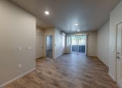 Thumbnail 6 of 14 - the spacious living room and dining room in a new home at Springview by Vintage, 89512