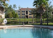 Thumbnail 4 of 21 - Swimming Pool area at Carolina Club Apartments, Daytona Beach, Florida