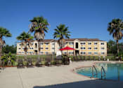 Thumbnail 5 of 21 - Swimming pool at Carolina Club Apartments, Daytona Beach, FL, 32114