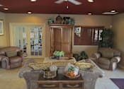 Thumbnail 14 of 21 - Clubhouse seating living area at Carolina Club Apartments, Daytona Beach