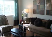 Thumbnail 19 of 21 - Living room with window at Carolina Club Apartments, Daytona Beach, FL, 32114