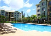 Thumbnail 12 of 16 - Pool with lounge chairs at Harbour Cove, Hallandale Beach, FL