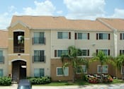 Thumbnail 3 of 15 - Exterior building with parking at Hawk's Landing Apartments, Florida